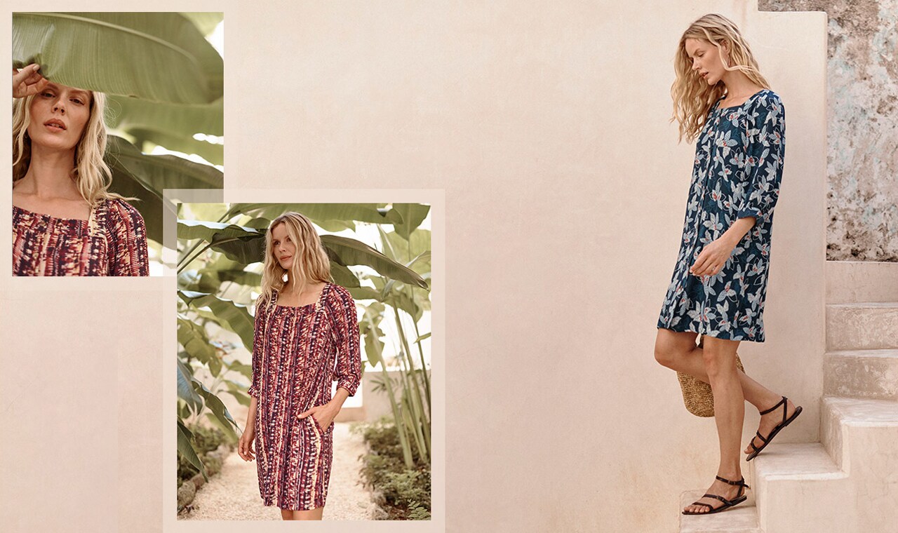 A woman in our Jardin Crepe Dress in shades of red and blue. Browse the Wabi-Sabi Collection.
