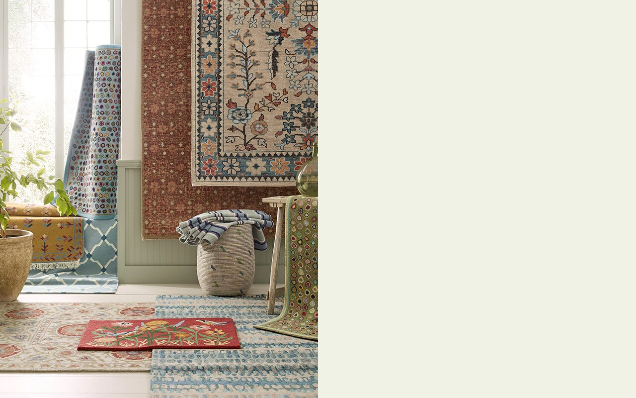 A collection of rugs and doormats in various colorful patterns. Shop rugs.